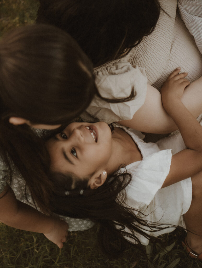 family cuddles during photo session with a cincinnati family photographer