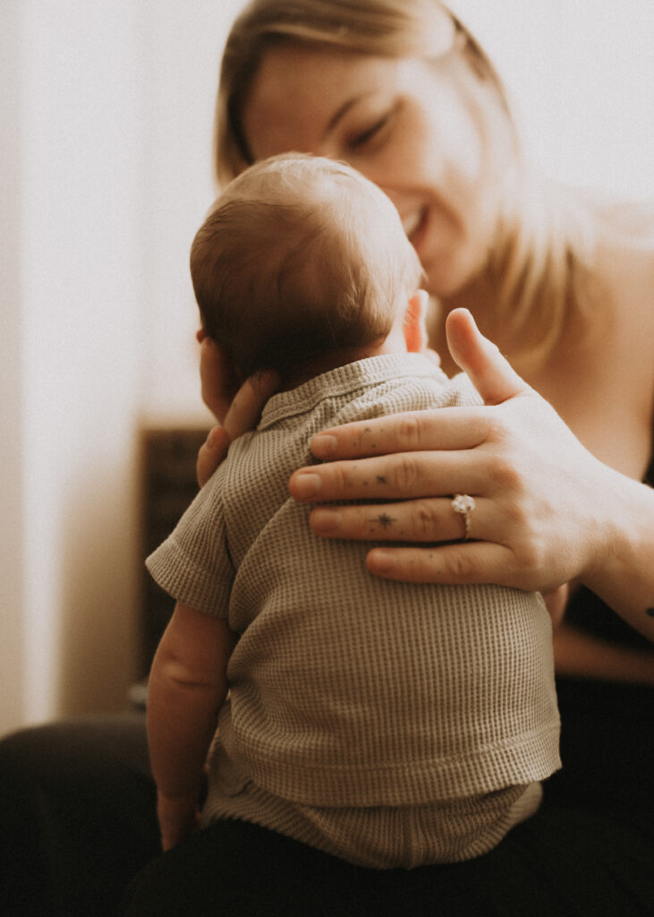 burping newborn baby