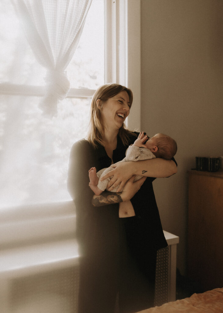 mother holding newborn baby