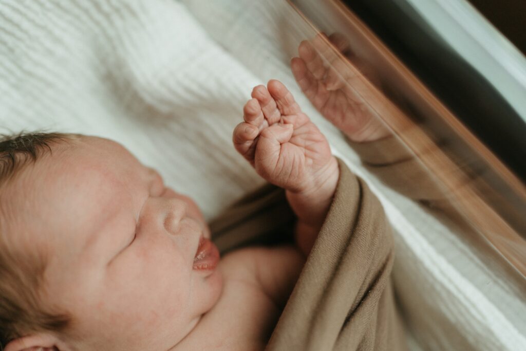 newborn hand during fresh 48 lifestyle session