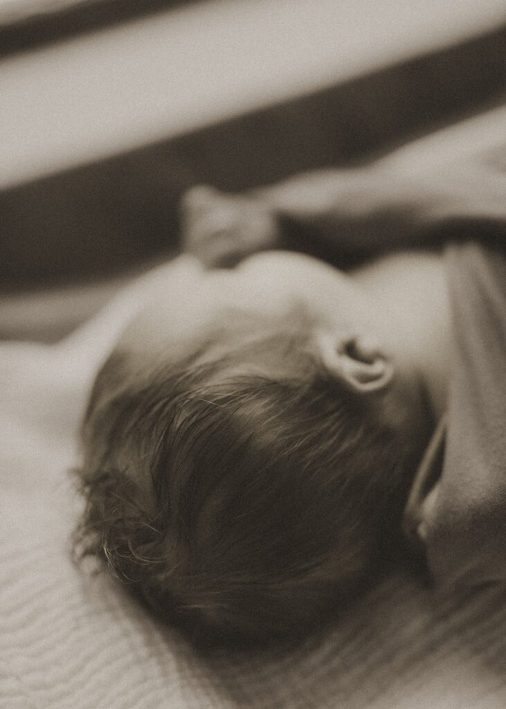black and white shot of newborn's hair during cincinnati fresh 48 session