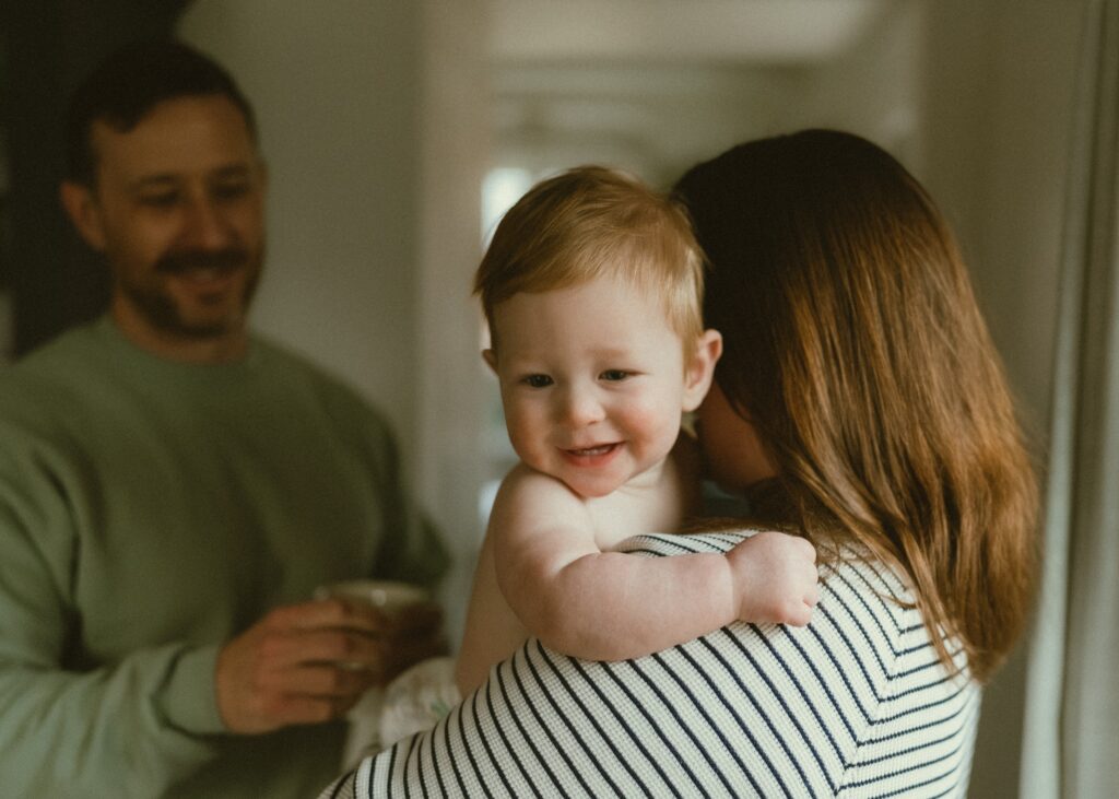 Cincinnati family candidly smiling during their in home lifestyle photo session