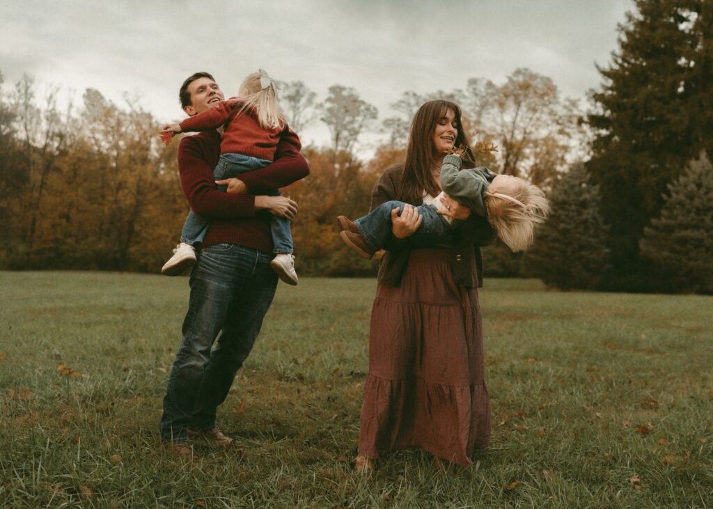 parents playing with toddlers during photography child led session