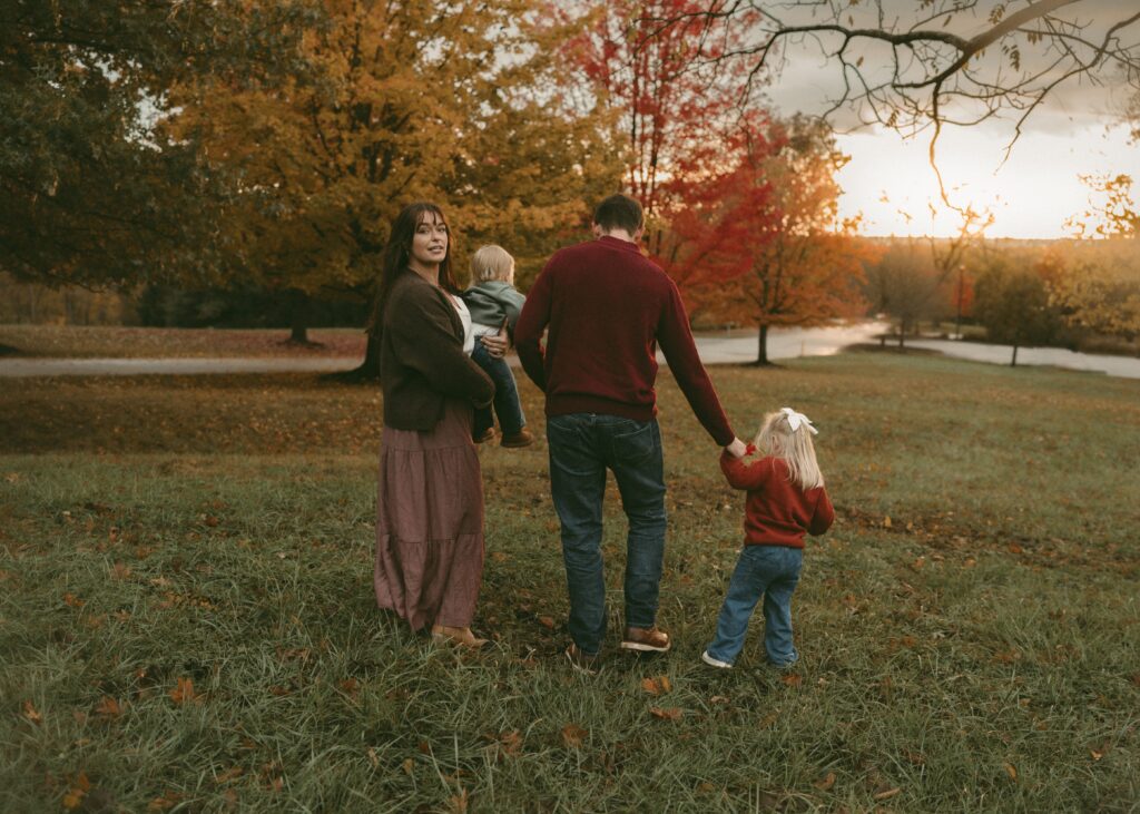beautiful sunset during cincinnati photography session with mom looking back at camera