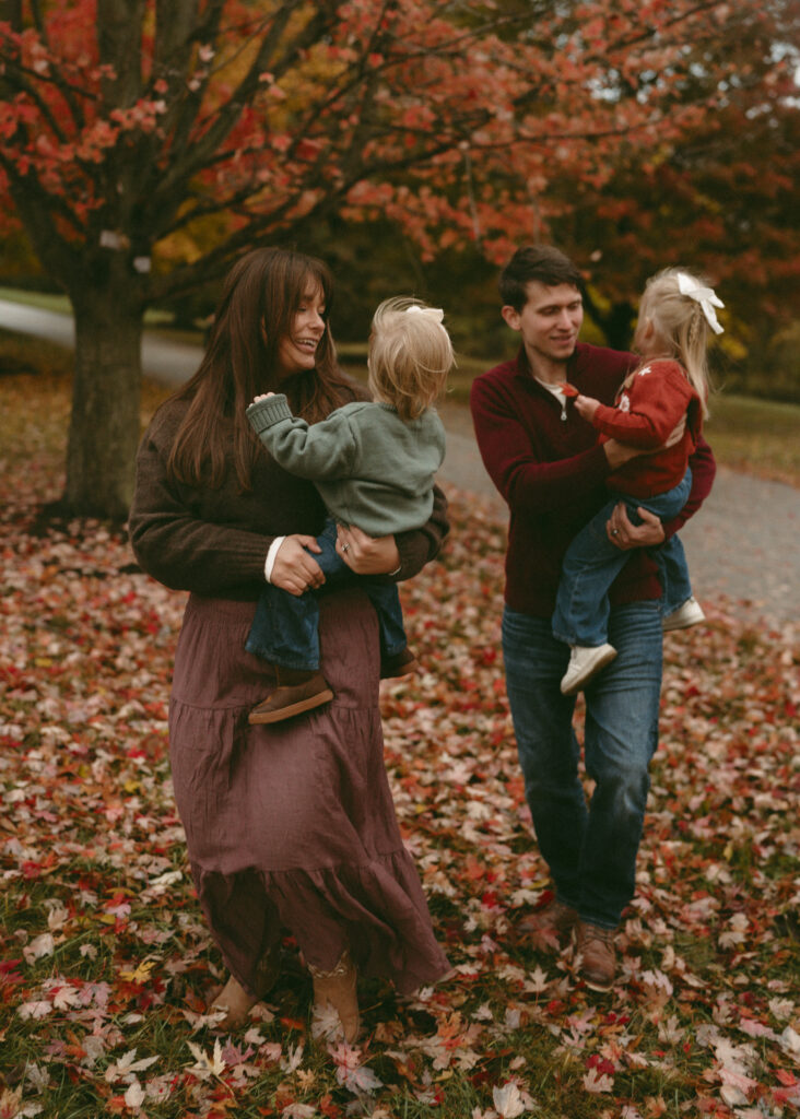 family walking the park during fall for family photo session at french park in cincinnati