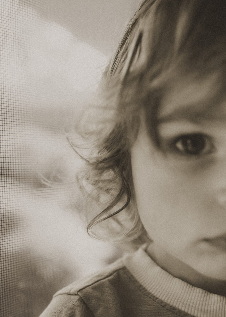 black and white close up image of toddler boy's curls