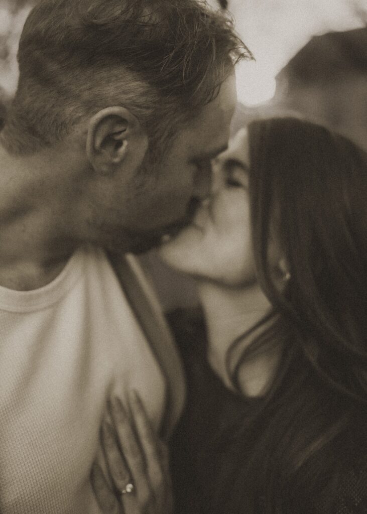 close up black and white shot of mom and dad kissing during their photography session with cincinnati lifestyle photographer sun and vine