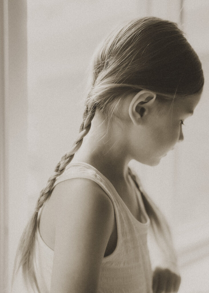 black and white photo of toddler girl's braid