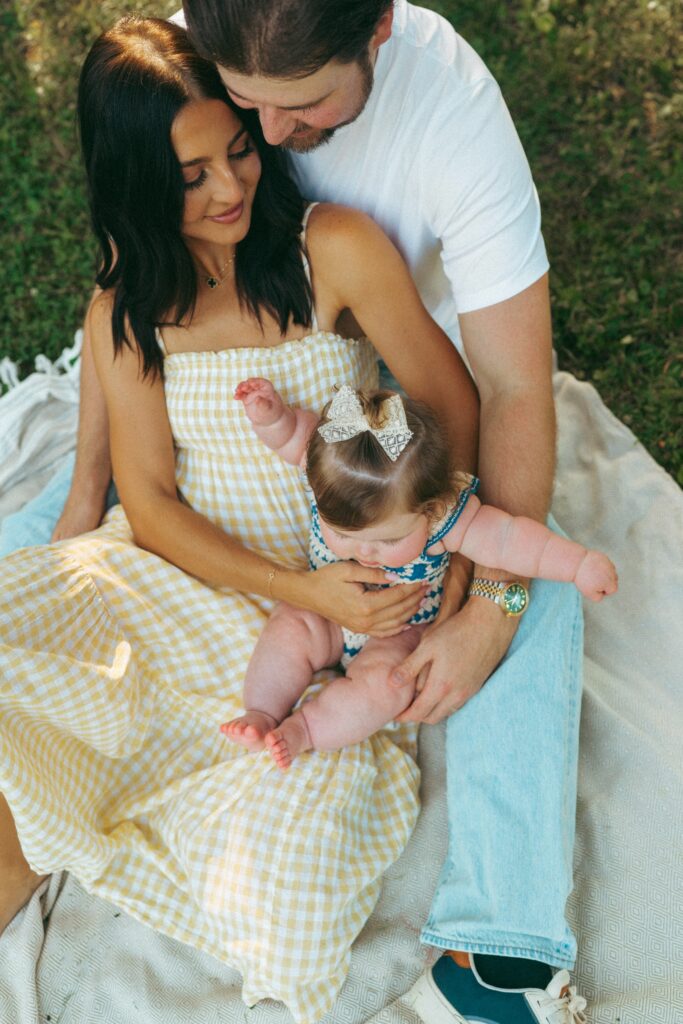 family showing different colors and patterns in their outfits during the lifestyle photographer session in cincinnati