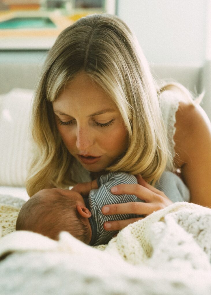 mom comforting her newborn baby